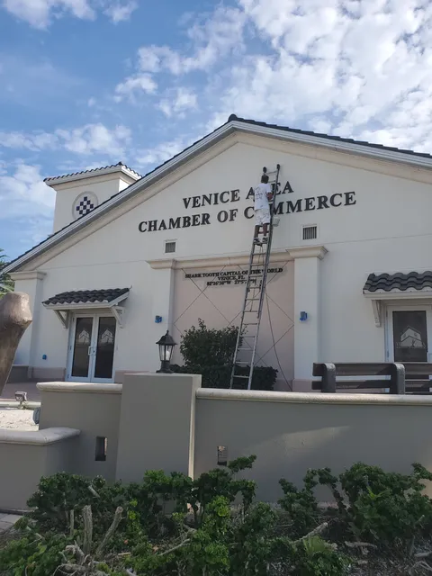 Kranenburg Painting crew repainting the exterior of the Venice Area Chamber of Commerce building
