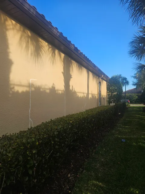 Stucco wall crack repair marked out before exterior painting in Southwest Florida