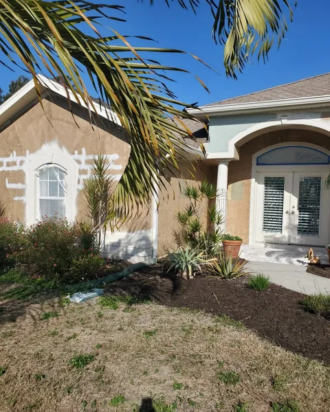 Stucco home prepped and repainted in Southwest Florida