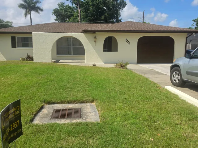 Freshly painted single-story home exterior in Marco Island, FL