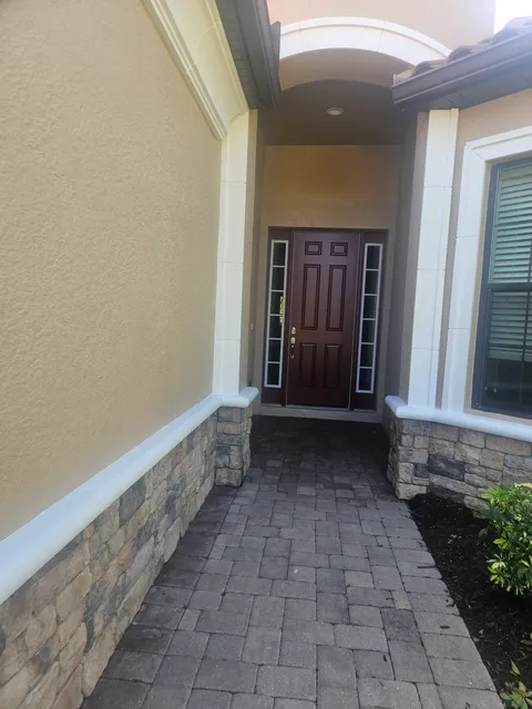 Freshly painted entry door and trim on a Southwest Florida home