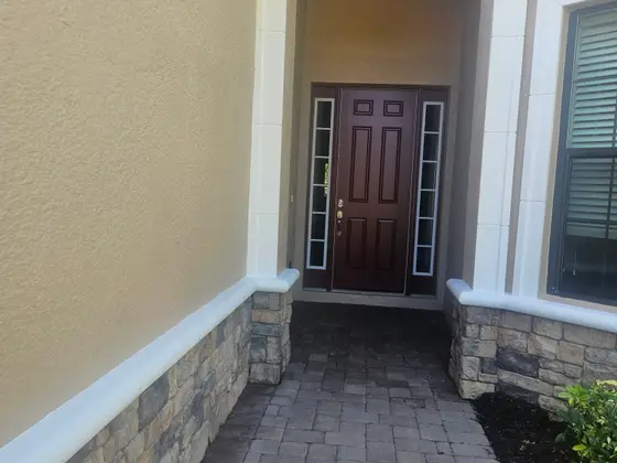 Freshly painted entry door and trim on a Southwest Florida home