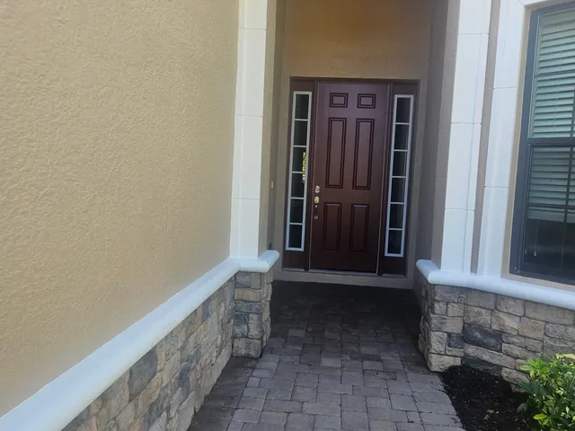 Freshly painted entry door and trim on a Southwest Florida home