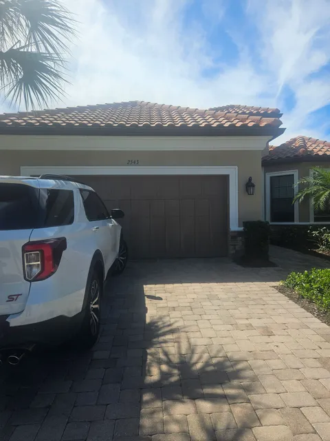 Residential exterior repaint on a tile-roof home in Southwest Florida