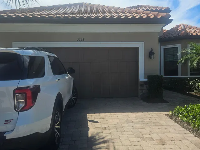 Residential exterior repaint on a tile-roof home in Southwest Florida